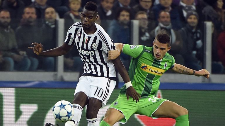 Paul Pogba vies with Monchengladbach's Swiss midfielder Granit Xhaka