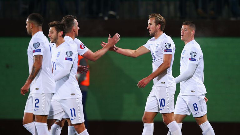 Harry Kane of England (10) celebrates with team-mates as his shot rebounds off goalkeeper Giedrius Arlauskis of Lithuania 