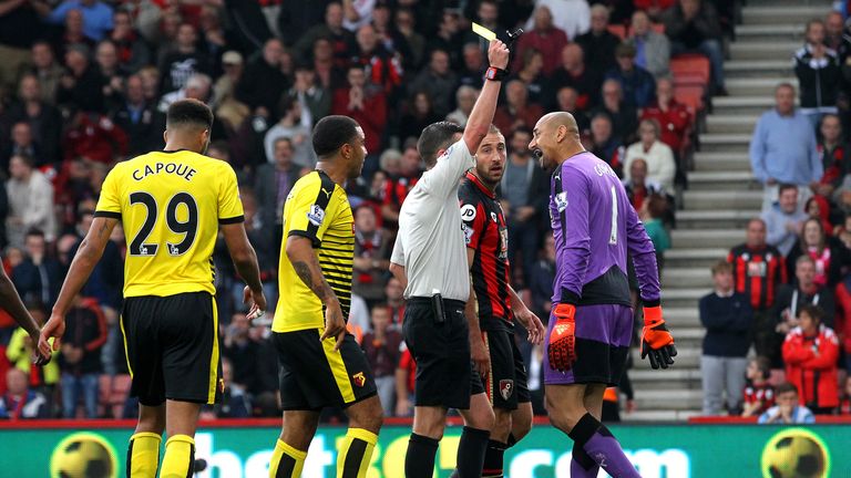 Heurelho Gomes of Watford is shown a yellow card by referee Michael Oliver during the Barclays Premier League match at Bournemouth