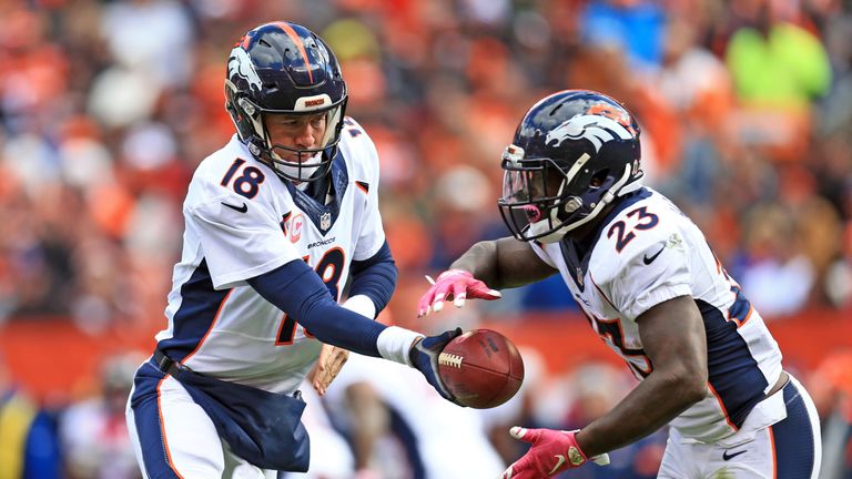 Peyton Manning hands the ball of to Broncos running back Ronnie Hillman during the fourth quarter against the Cleveland Browns.