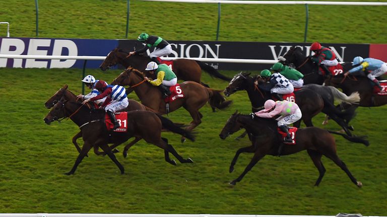 Adam Beschizza on Grumeti (bottom left) wins Betfred Cesarewitch during day two of the Dubai Future Champions Festival at Newmarket Racecourse. PRESS ASSOC