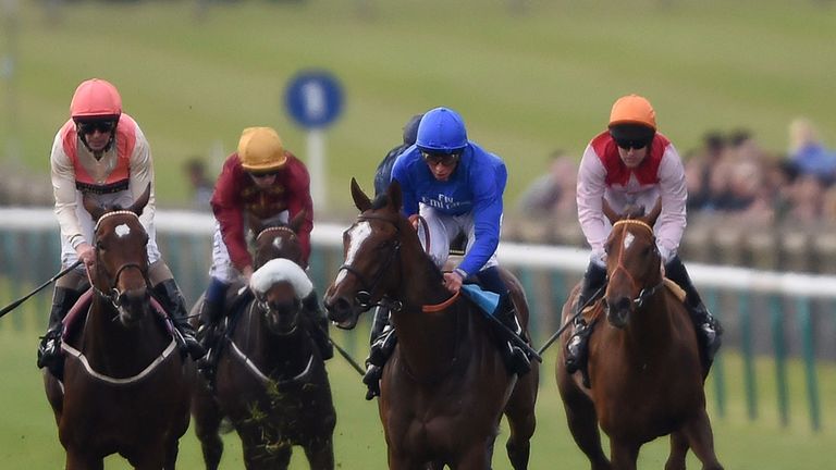 Mistrusting ridden by William Buick (right, blue cap) leads the field home to win The Vision EBF Stallions Boadicea Fillies' Stakes during day two of the D
