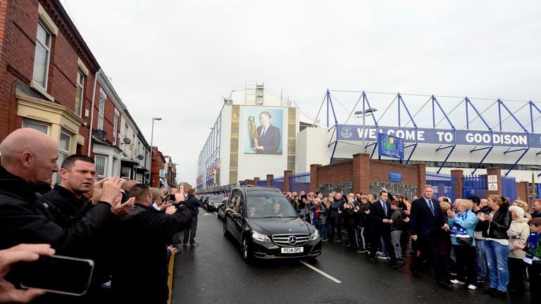 Crowds line the street outside Everton's Goodison Park ground as Howard Kendall's funeral cortege passes
