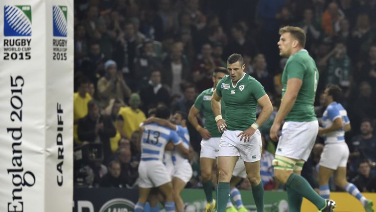 Ireland's centre Robbie Henshaw (C) reacts