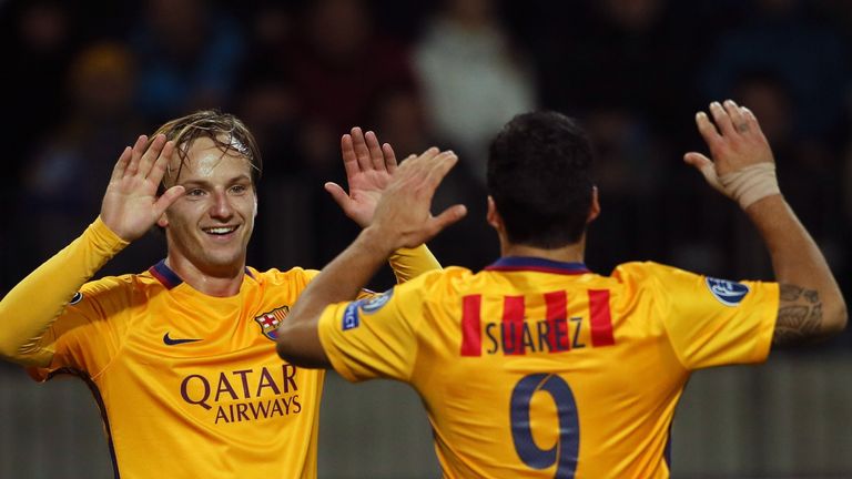 Ivan Rakitic celebrates his first Barcelona goal with Luis Suarez