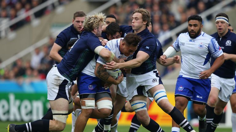 Jack Lam of Samoa is tackled by Richie Gray and Jonny Gray of Scotland during the 2015 Rugby World Cup Pool B match between Samoa and Scotland 