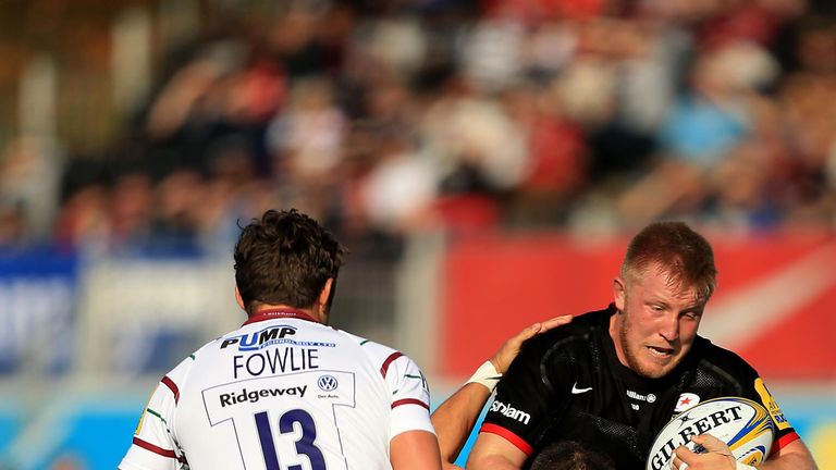 Saracens flanker Jackson Wray is tackled by Fergus Mulchrone of London Irish 