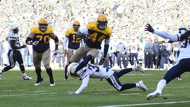 James Starks #44 of the Green Bay Packers carries the football toward the endzone for a spectacular touchdown against San Diego.