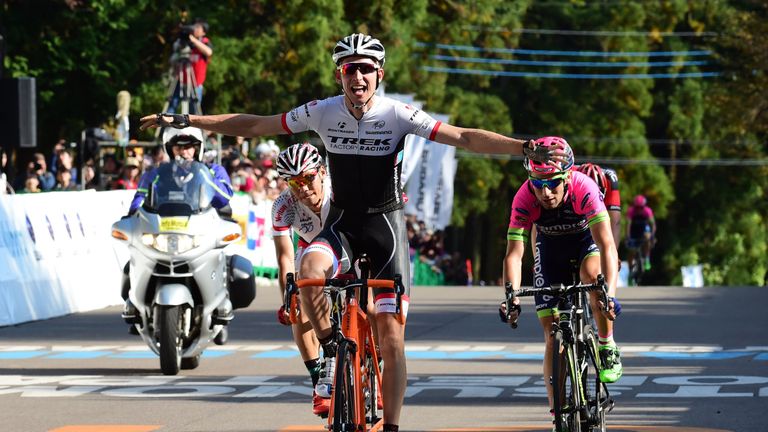 Dutch cyclist Bauke Mollema (C) of Trek Factory Racing reacts after winning the Japan Cup cycling road race in Utsunomiya