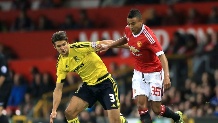 Manchester United's Jesse Lingard (right) and Middlesbrough's George Friend battle for the ball 