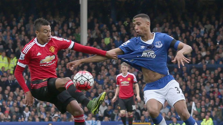 Jesse Lingard gets to grips with Everton's Brendan Galloway at Goodison Park on Saturday