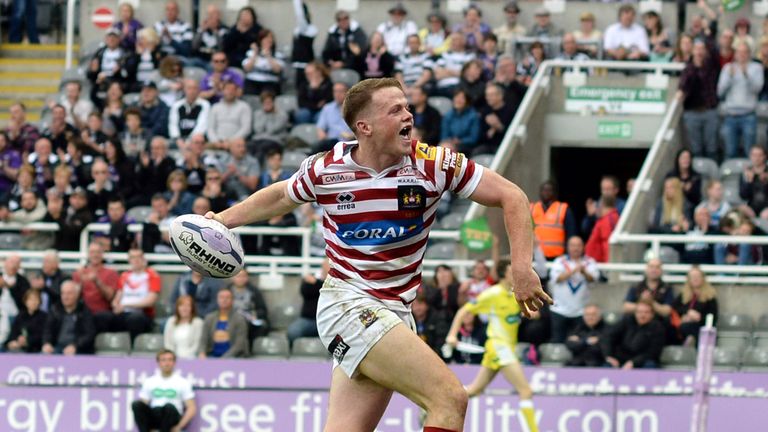 Joe Burgess of Wigan Warriors celebrates scoring a try during the Super League match with Leeds Rhinos