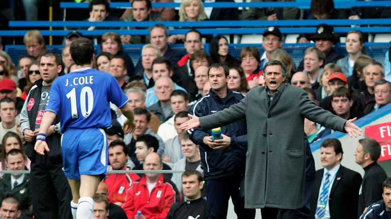 Joe Cole of Chelsea walks over to the bench to listen to Manager, Jose Mourinho after scoring the first goal of the game against Fulham in 2005