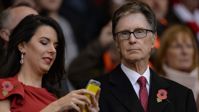 Liverpool's American owner John W Henry (right) in the stand at Anfield