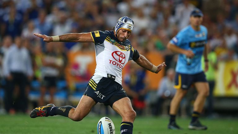Johnathan Thurston of the Cowboys kicks a drop goal in extra-time to win the 2015 NRL Grand Final