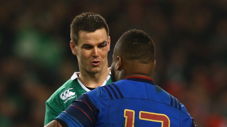 Johnny Sexton (L) of Ireland shakes hands with Mathieu Bastareaud of France