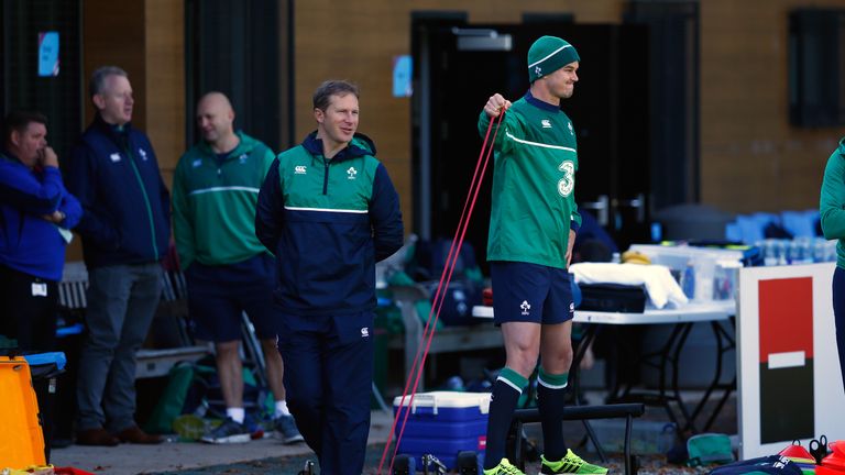 Johnny Sexton does some light exercise during Ireland training in Cardiff on Wednesday