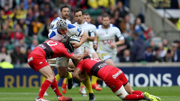 Clermont's Jonathan Davies is tackled by Toulon's Matt Giteau and Juan Martin Hernandez during the European Champions Cup Final at Twickenham