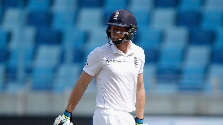 DUBAI, UNITED ARAB EMIRATES - OCTOBER 26:  Jos Buttler of England leaves the field after being dismissed by Yasir Shah of Pakistan during day five of the 2