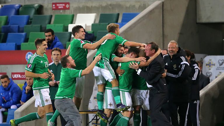 Northern Ireland's Josh Magennis celebrates scoring his side's second goal of the match with team-mates v Greece, Windsor Park