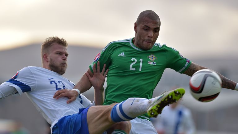 Josh Magennis (R) of Northern Ireland and Paulus Arajuuri (L) of Finland