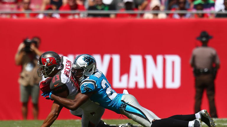 Vincent Jackson of the Tampa Bay Buccaneers is tackled by Josh Norman of the Carolina Panthers