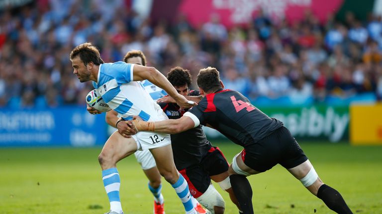 Juan Martin Hernandez of Argentina goes past Giorgi Nemsadze of Georgia during the 2015 Rugby World Cup Pool C