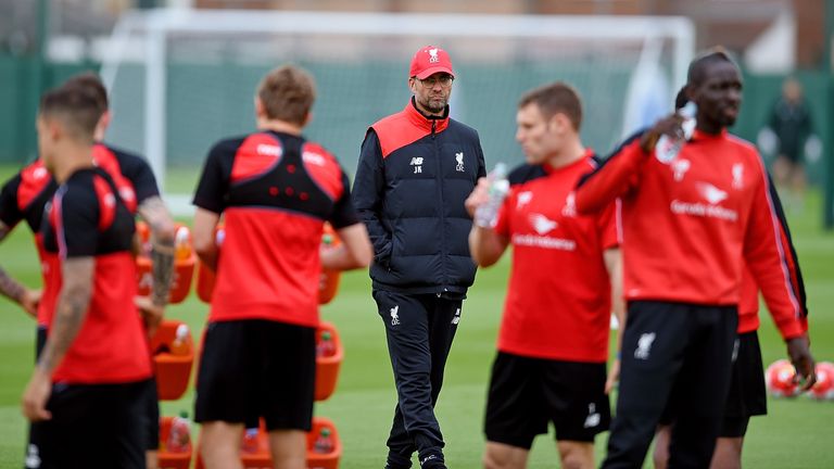Klopp keeps an eye on his new charges as they take a drinks break
