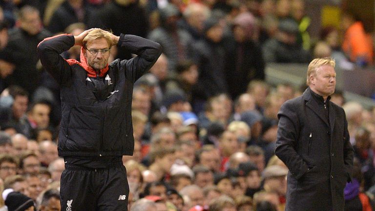Liverpool's German manager Jurgen Klopp (L) reacts on the touchline as Southampton's Dutch manager Ronald Koeman (R) looks on 
