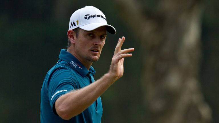 Justin Rose salutes the crowd after his second eagle of the day