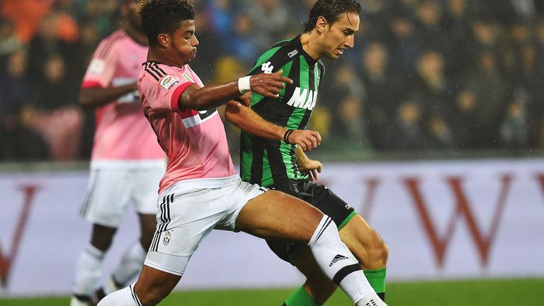 Sassuolo's Simone Missiroli (right) vies for the ball with Mario Lemina of Juventus