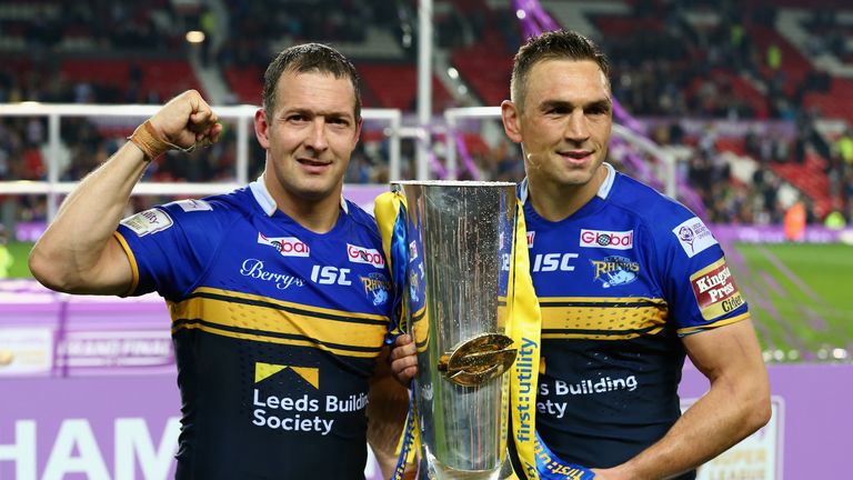 MANCHESTER, ENGLAND - OCTOBER 10:  Kevin Sinfield captain of the Leeds Rhinos (R) celebrates as he holds the Grand Final trophy