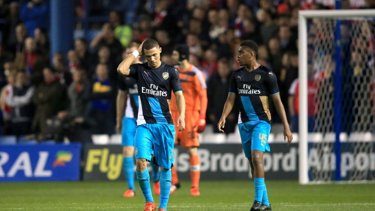 Arsenal's Kieran Gibbs walks away dejected after Sheffield Wednesday score their first goal