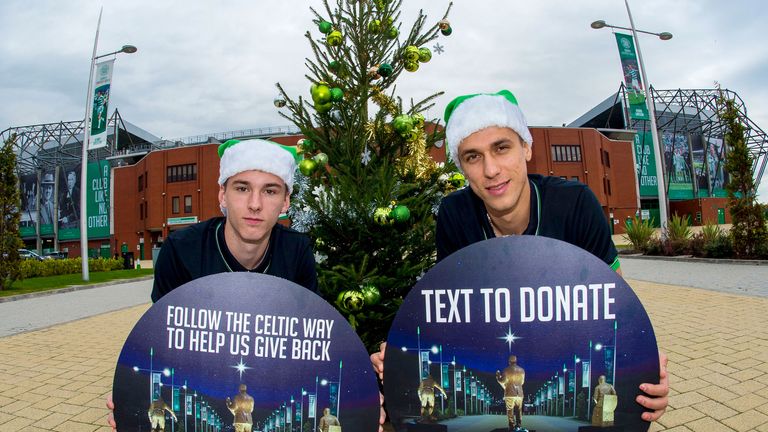 Kieran Tierney (left) and Jozo Simunovic promote Celtic's Christmas Appeal