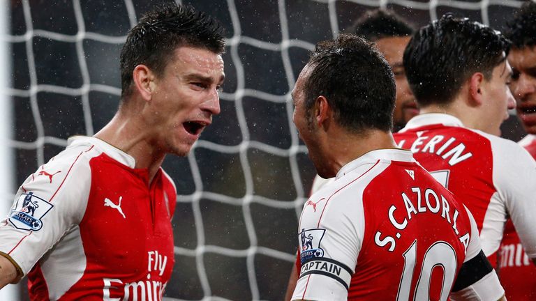 Laurent Koscielny (left) celebrates after scoring Arsenal's second goal
