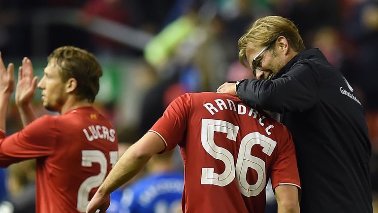 Liverpool's German manager Jurgen Klopp (R) jokes with Liverpool's English midfielder Connor Randall