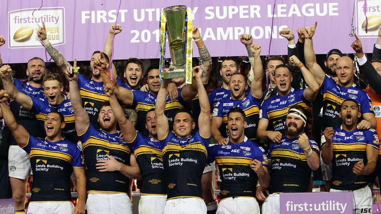 MANCHESTER, ENGLAND - OCTOBER 10:  Leeds Rhinos celebrate with the trophy after winning the Grand Final against Wigan Warrios during the First Utility Supe