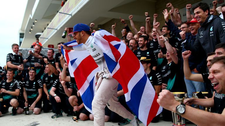 Lewis Hamilton celebrates with his Mercedes team