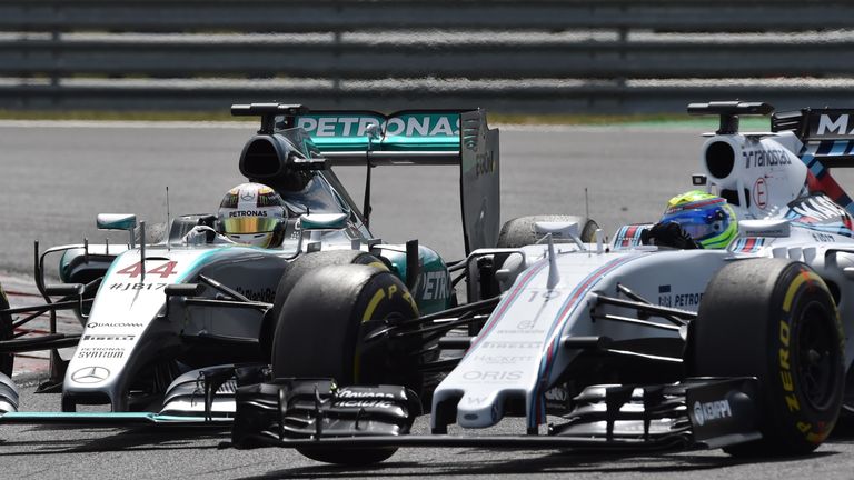 Mercedes' Lewis Hamilton battles with Williams' Felipe Massa on track