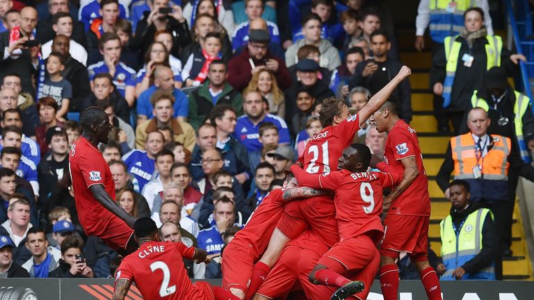 Philippe Coutinho is bundled by team-mates after putting Liverpool 2-1 up