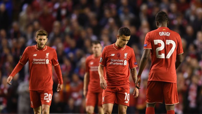 Dejected Liverpool players react after conceding the opening goal 