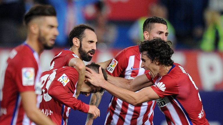 MADRID, SPAIN - OCTOBER 04:  Luciano Vietto of Club Atletico de Madrid celebrates with Tiago Mendes after scoring Atletico's  opening goal during the La Li