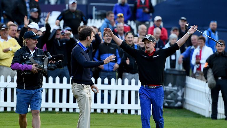 Luke Donald celebrates with Nick Dougherty after nailing a huge putt in Friday's Masterclass
