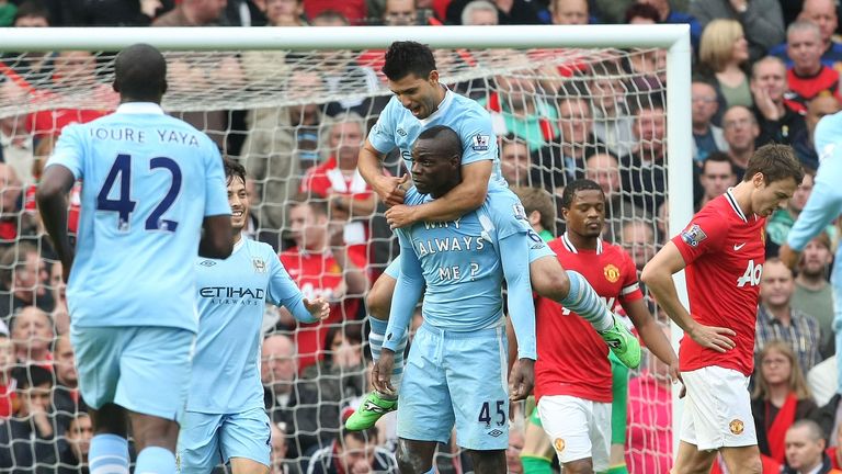 Mario Balotelli of Manchester City celebrates scoring their first goal of a 6-1 victory at Old Trafford in October 2011