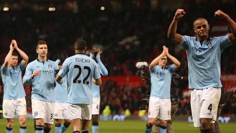 Vincent Kompany (R) of Manchester City celebrates after the April 8, 2013 derby