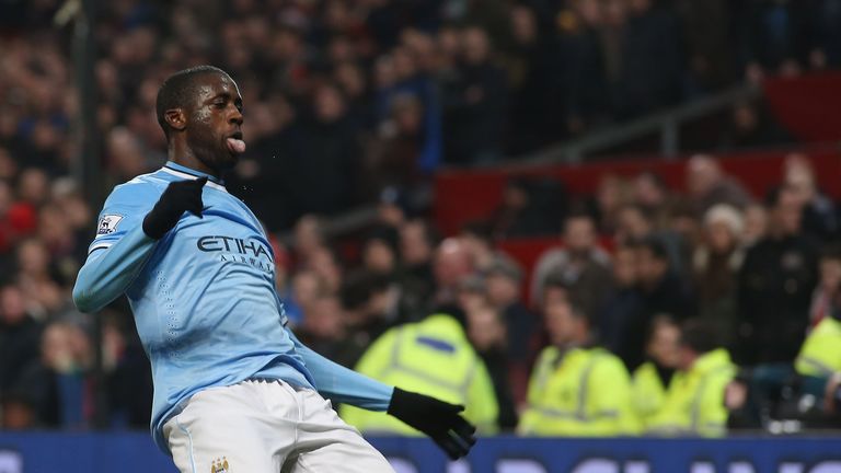 Yaya Toure of Manchester City celebrates scoring their third goal in a 3-0 victory at Old Trafford on March 25, 2014