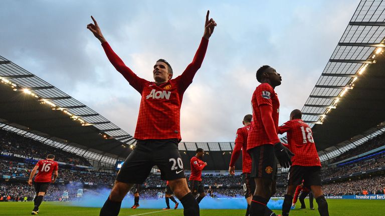 Manchester United's players celebrate Robin Van Persie's (L) late winning goal in the December 9, 2012 derby