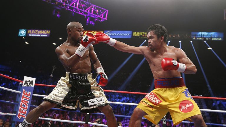 Floyd Mayweather Jr exchange punches with Manny Pacquiao