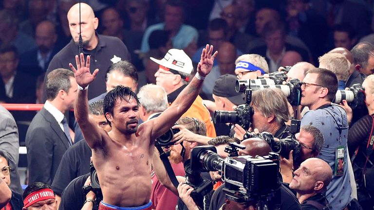 Manny Pacquiao gestures to the crowd