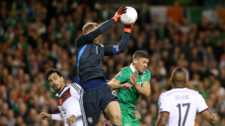 Germany goalkeeper Manuel Neuer claims a high ball from above Republic of Ireland's Jonathan Walters during the European Qualifier in Dublin